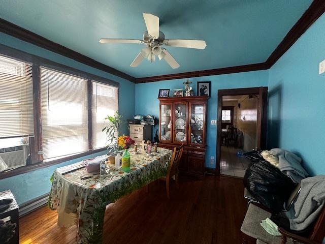 2428 N Lorel Ave, Chicago, IL 60639 - dining room featuring wood finished floors, crown molding, ceiling fan, and cooling unit