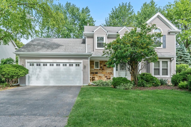 2208 Broadway Ln, Schaumburg, IL 60194 - view of front facade featuring asphalt driveway, a front yard, an attached garage, stone siding, and a shingled roof
