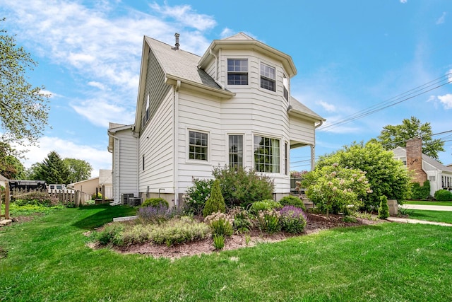 1048 Somonauk St, Sycamore, IL 60178 - view of side of home with a yard, roof with shingles, and cooling unit
