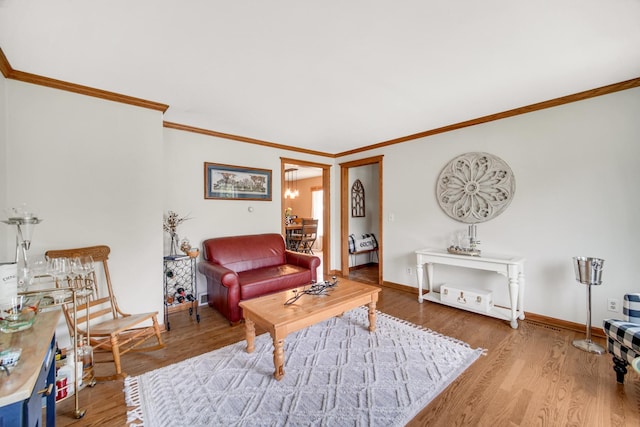 1048 Somonauk St, Sycamore, IL 60178 - living room featuring ornamental molding, wood finished floors, and baseboards