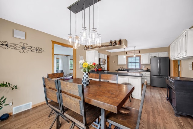 1048 Somonauk St, Sycamore, IL 60178 - dining space with light wood finished floors