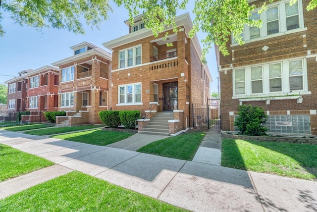 6834 S Rockwell St, Chicago, IL 60629 - view of front of property with brick siding and a front lawn