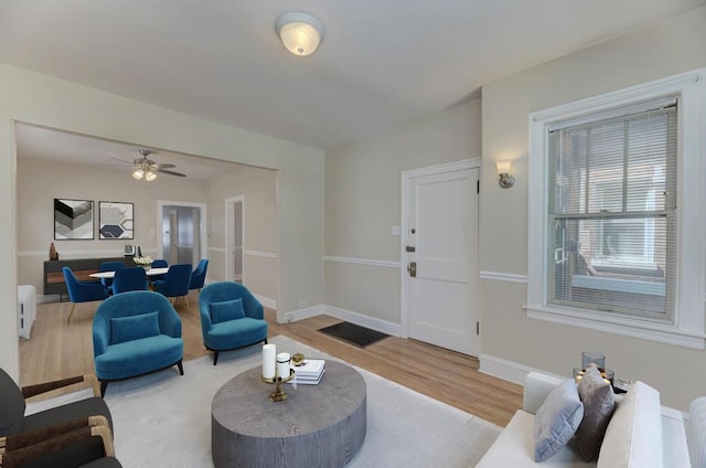 6834 S Rockwell St, Chicago, IL 60629 - living area with wood finished floors, baseboards, ceiling fan, and radiator