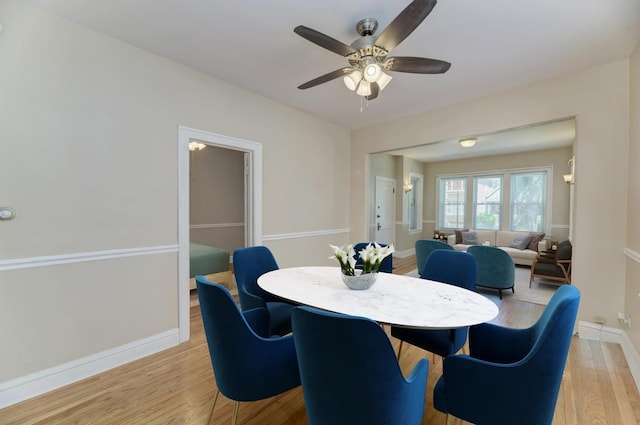 6834 S Rockwell St, Chicago, IL 60629 - dining room with light wood finished floors, ceiling fan, and baseboards