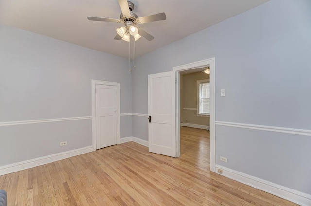 6834 S Rockwell St, Chicago, IL 60629 - unfurnished room featuring a ceiling fan, baseboards, and light wood-style floors
