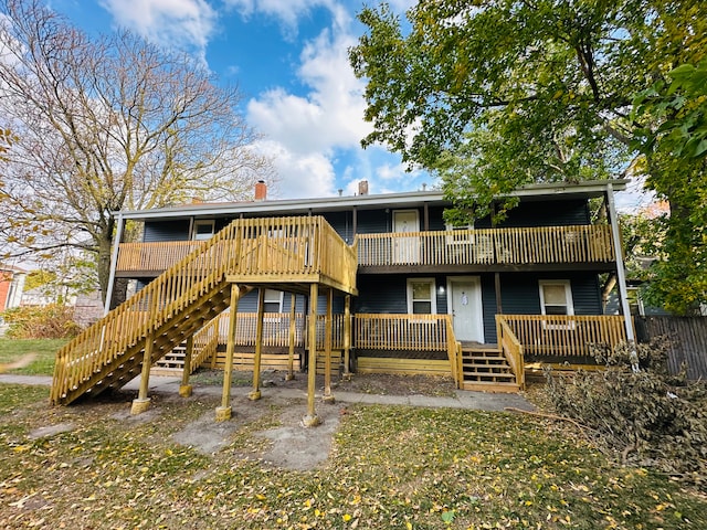 220 S Entrance Ave, Kankakee, IL 60901 - back of house featuring stairs, a wooden deck, and a chimney