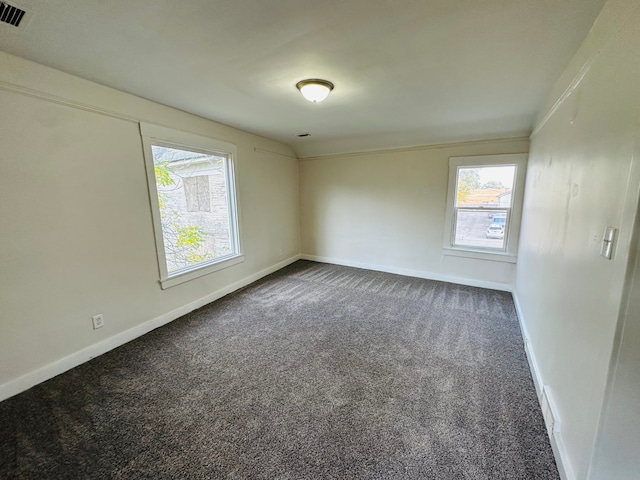 220 S Entrance Ave, Kankakee, IL 60901 - empty room with dark carpet and baseboards