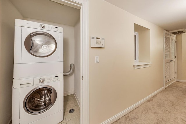 4440 N Dover St Unit Gs, Chicago, IL 60640 - washroom featuring stacked washer and clothes dryer and baseboards