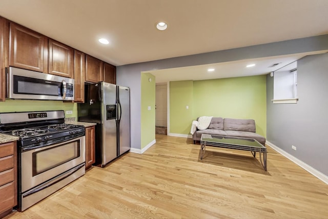 4440 N Dover St Unit Gs, Chicago, IL 60640 - kitchen featuring stainless steel appliances, light wood-style flooring, recessed lighting, and open floor plan