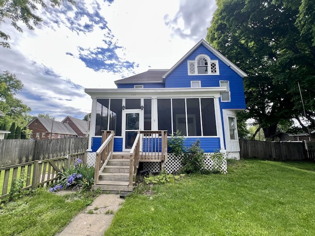 335 N Highway Ave, Deland, IL 61839 - rear view of house featuring a sunroom
