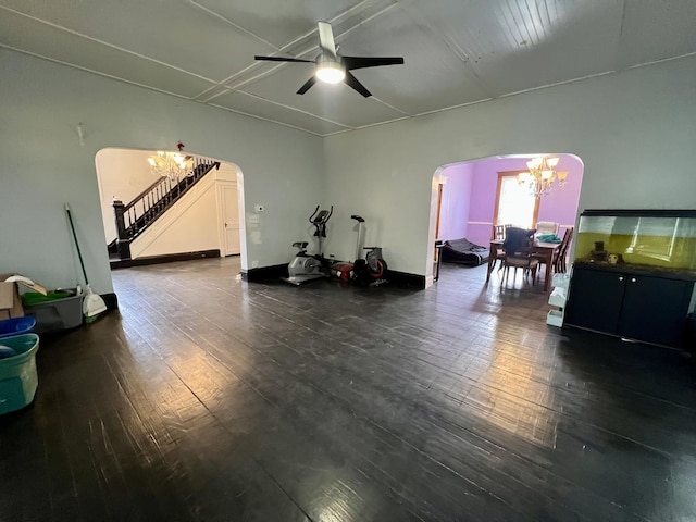335 N Highway Ave, Deland, IL 61839 - miscellaneous room with arched walkways, a chandelier, wood finished floors, stairs, and a ceiling fan