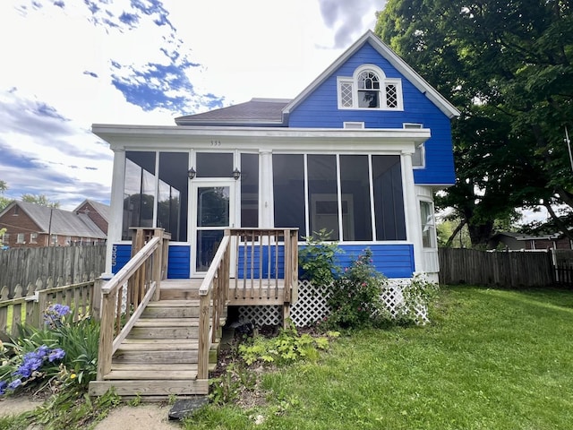 335 N Highway Ave, Deland, IL 61839 - rear view of house featuring a sunroom