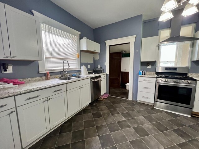 335 N Highway Ave, Deland, IL 61839 - kitchen featuring stainless steel appliances, a sink, white cabinetry, wall chimney exhaust hood, and dark tile patterned flooring