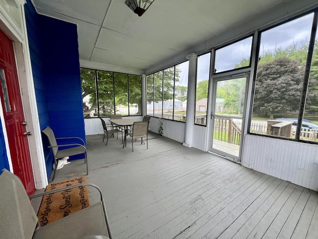 335 N Highway Ave, Deland, IL 61839 - sunroom / solarium featuring healthy amount of natural light and outdoor dining area