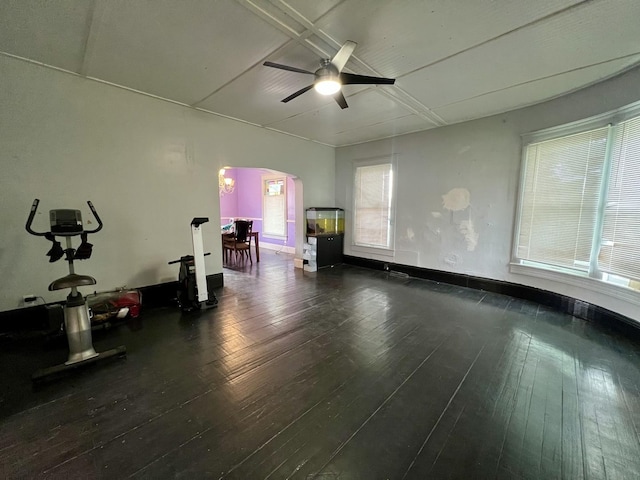 335 N Highway Ave, Deland, IL 61839 - unfurnished room featuring arched walkways, hardwood / wood-style floors, a ceiling fan, and baseboards