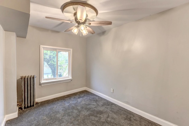 614 E 92nd Pl, Chicago, IL 60619 - unfurnished room with radiator, dark carpet, ceiling fan, and baseboards