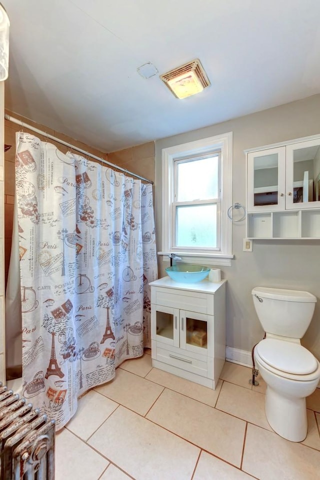 614 E 92nd Pl, Chicago, IL 60619 - full bathroom with toilet, tile patterned flooring, and a sink