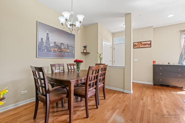 2127 Apple Hill Ln, Buffalo Grove, IL 60089 - dining room featuring baseboards, light wood-style floors, and a chandelier