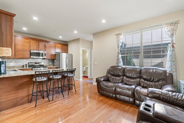 2127 Apple Hill Ln, Buffalo Grove, IL 60089 - living room with light wood-style flooring, recessed lighting, and baseboards