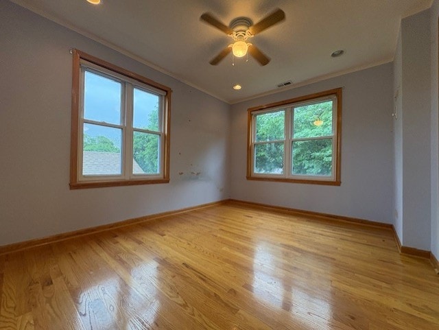8834 S E End Ave, Chicago, IL 60617 - unfurnished room featuring ornamental molding, ceiling fan, light wood-type flooring, and baseboards