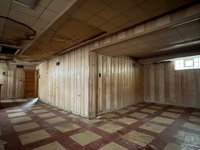8834 S E End Ave, Chicago, IL 60617 - below grade area featuring tile patterned floors and wood walls