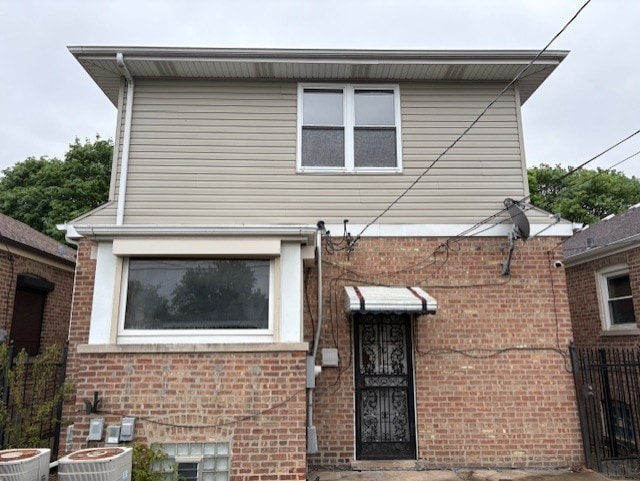 8834 S E End Ave, Chicago, IL 60617 - view of front of property with brick siding and central AC