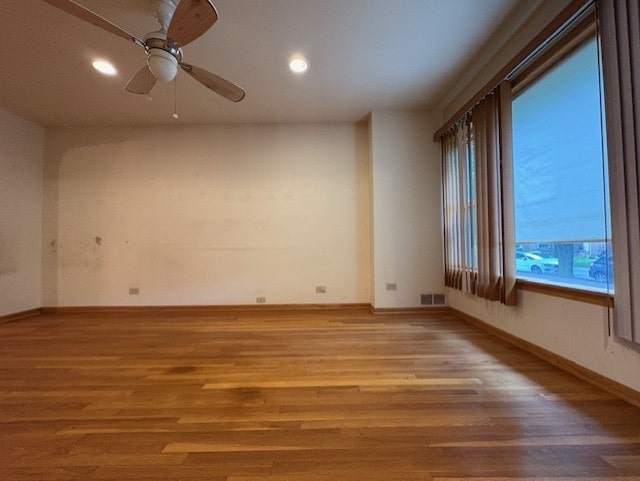 8834 S E End Ave, Chicago, IL 60617 - spare room with wood finished floors, recessed lighting, baseboards, and a ceiling fan