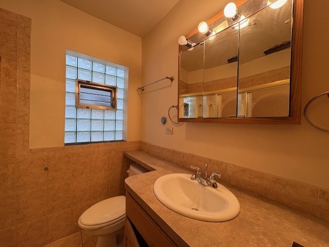 8834 S E End Ave, Chicago, IL 60617 - bathroom with vanity, toilet, a shower, and tile walls
