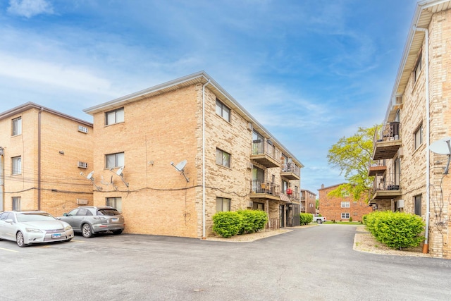 6319 W 64th Pl Unit 1N, Chicago, IL 60638 - view of apartment building / complex featuring uncovered parking
