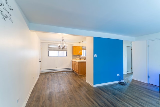 6319 W 64th Pl Unit 1N, Chicago, IL 60638 - unfurnished living room featuring baseboard heating, a chandelier, dark wood finished floors, and baseboards