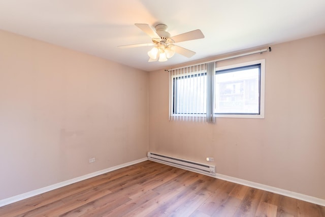 6319 W 64th Pl Unit 1N, Chicago, IL 60638 - unfurnished room with a baseboard heating unit, wood finished floors, and ceiling fan