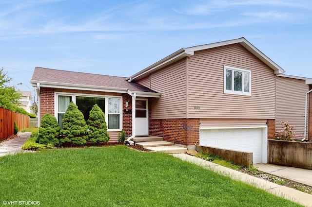 959 S Fern Ave, Elmhurst, IL 60126 - tri-level home with a garage, brick siding, and driveway