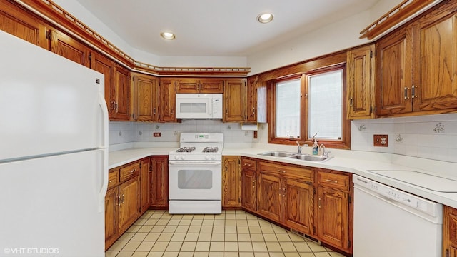 959 S Fern Ave, Elmhurst, IL 60126 - kitchen with white appliances, a sink, tasteful backsplash, light countertops, and recessed lighting