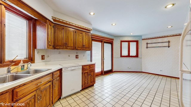 959 S Fern Ave, Elmhurst, IL 60126 - kitchen featuring dishwasher, light countertops, a sink, recessed lighting, and light tile patterned floors