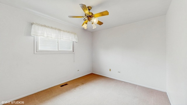 959 S Fern Ave, Elmhurst, IL 60126 - empty room featuring light carpet, a ceiling fan, and baseboards