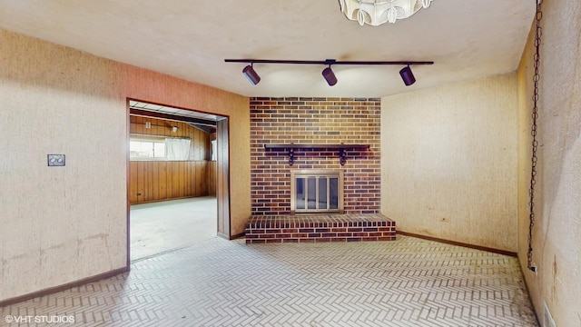 959 S Fern Ave, Elmhurst, IL 60126 - unfurnished living room featuring a brick fireplace and baseboards