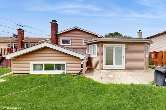 959 S Fern Ave, Elmhurst, IL 60126 - rear view of property with a chimney, a patio area, and a shingled roof