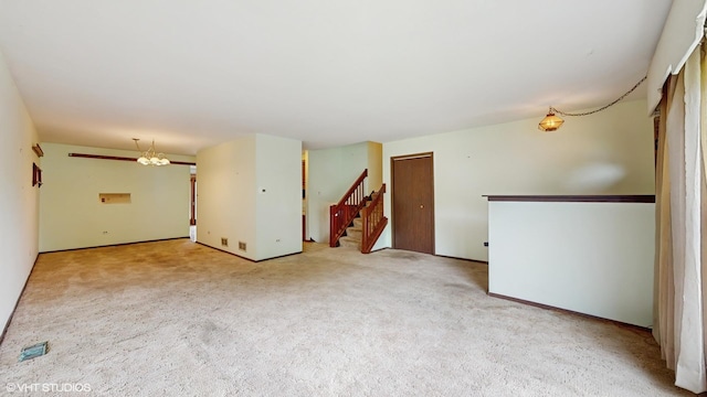 959 S Fern Ave, Elmhurst, IL 60126 - carpeted empty room featuring stairs and baseboards
