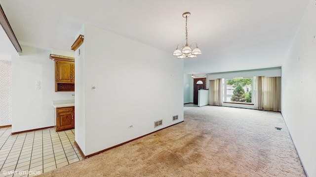 959 S Fern Ave, Elmhurst, IL 60126 - spare room featuring a chandelier, baseboards, and light carpet