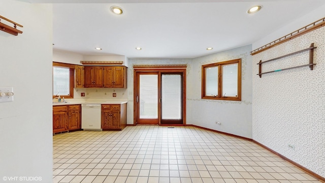 959 S Fern Ave, Elmhurst, IL 60126 - kitchen featuring white dishwasher, light countertops, brown cabinets, wallpapered walls, and recessed lighting