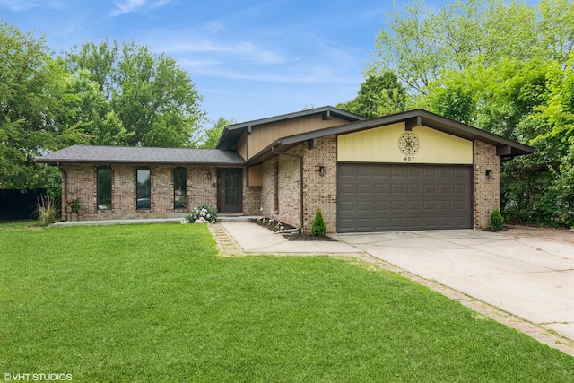 407 Greenfield Rd, Shorewood, IL 60404 - view of front of property featuring an attached garage, brick siding, driveway, and a front yard