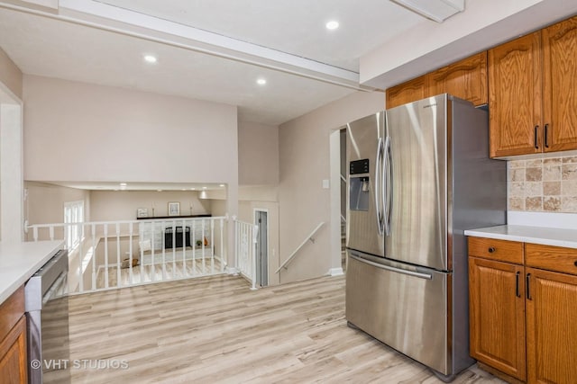 407 Greenfield Rd, Shorewood, IL 60404 - kitchen with appliances with stainless steel finishes, brown cabinets, light countertops, and recessed lighting