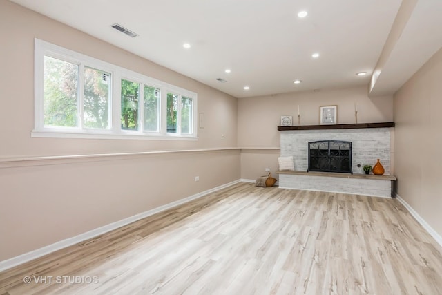 407 Greenfield Rd, Shorewood, IL 60404 - unfurnished living room featuring baseboards, a brick fireplace, wood finished floors, and recessed lighting
