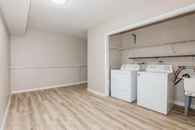 407 Greenfield Rd, Shorewood, IL 60404 - washroom featuring washing machine and clothes dryer, light wood-style floors, and baseboards