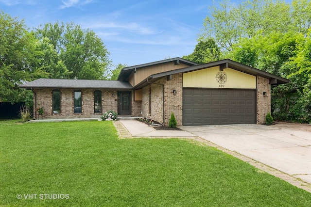 407 Greenfield Rd, Shorewood, IL 60404 - view of front of home featuring a garage, driveway, brick siding, and a front yard