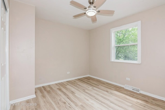 407 Greenfield Rd, Shorewood, IL 60404 - unfurnished room with light wood finished floors, baseboards, and ceiling fan