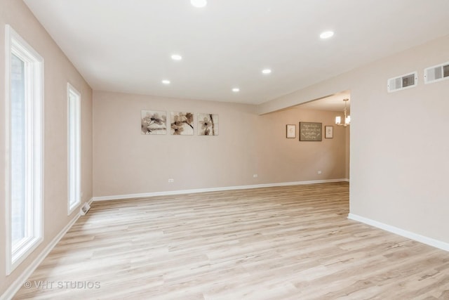 407 Greenfield Rd, Shorewood, IL 60404 - unfurnished room with recessed lighting, light wood-style flooring, a chandelier, baseboards, and healthy amount of natural light