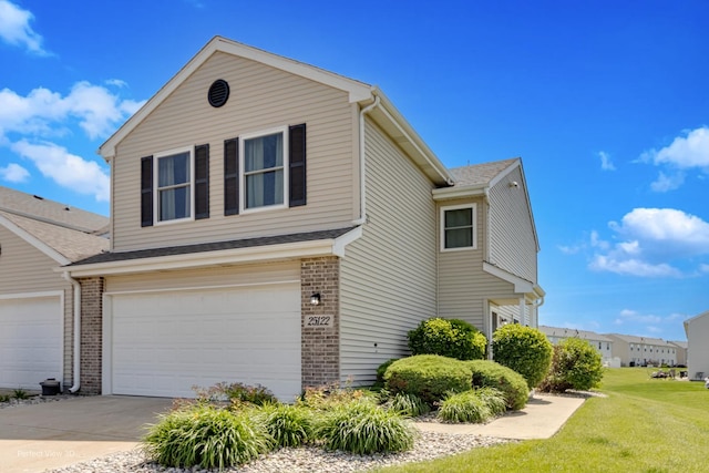 25122 Faraday Rd, Manhattan, IL 60442 - view of side of home with brick siding, an attached garage, a lawn, and driveway
