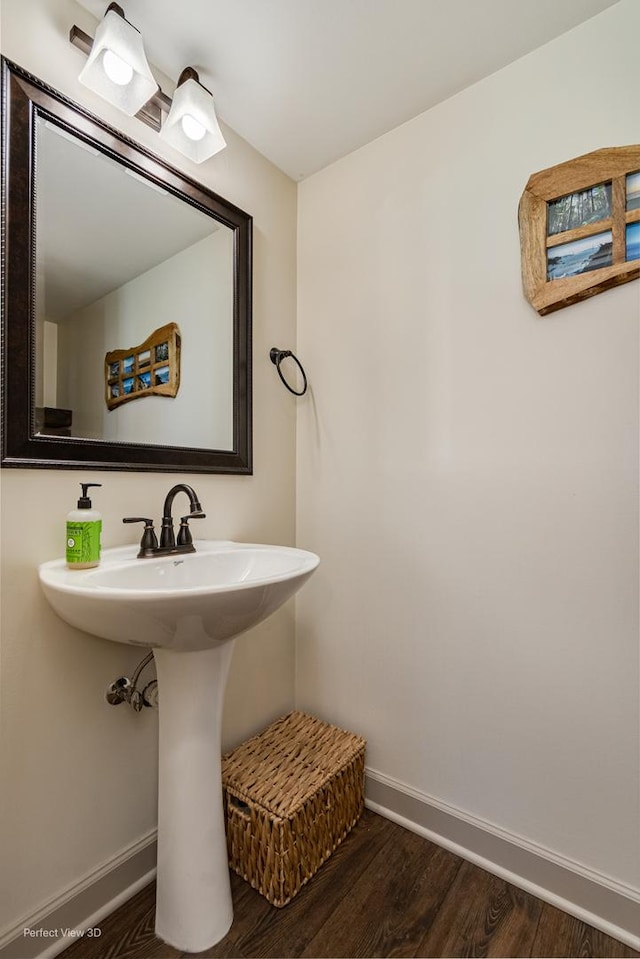 25122 Faraday Rd, Manhattan, IL 60442 - bathroom with baseboards, wood finished floors, and a sink