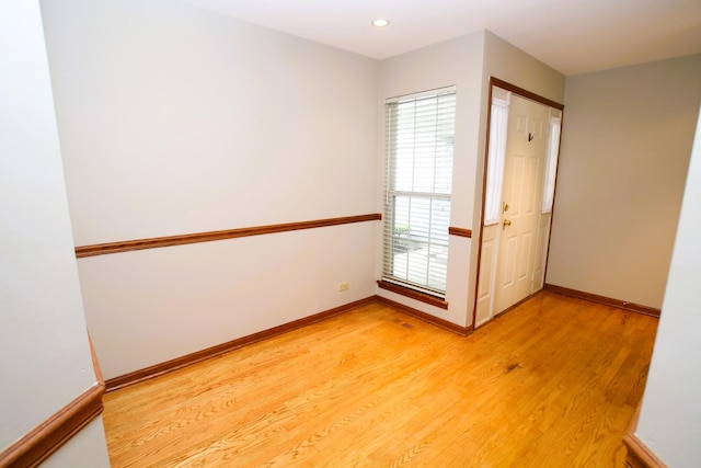 176 Millers Xing, Itasca, IL 60143 - empty room featuring light wood finished floors, baseboards, and recessed lighting